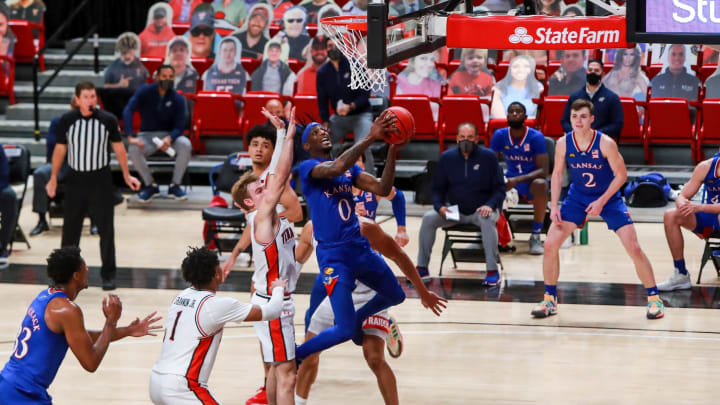 LUBBOCK, TEXAS – DECEMBER 17: Guard Marcus Garrett #0 of the Kansas Jayhawks shoots a layup during the second half of the college basketball game against the Texas Tech Red Raiders at United Supermarkets Arena on December 17, 2020 in Lubbock, Texas. (Photo by John E. Moore III/Getty Images)