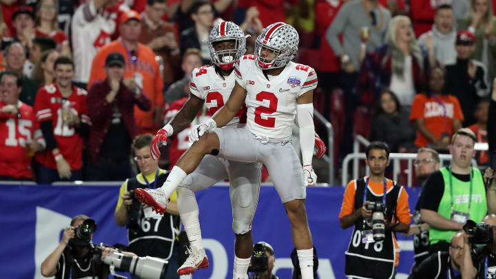 December 31, 2016; Glendale, AZ, USA; Ohio State Buckeyes safety Malik Hooker (24) celebrates with cornerback Marshon Lattimore (2) after intercepting pass against the Clemson Tigers during the first half of the the 2016 CFP semifinal at University of Phoenix Stadium. Mandatory Credit: Matthew Emmons-USA TODAY Sports