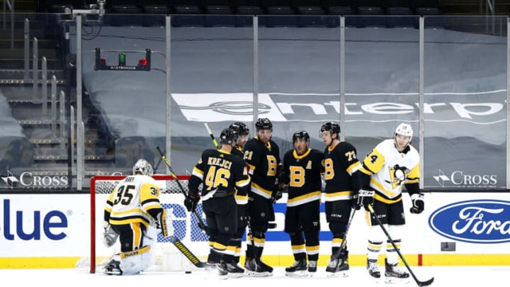 BOSTON, MASSACHUSETTS - JANUARY 26: Nick Ritchie #21 of the Boston Bruins, center, celebrates with David Krejci #46, Brad Marchand #63 and Charlie McAvoy after scoring a goal against the Pittsburgh Penguins during the first period at TD Garden on January 26, 2021 in Boston, Massachusetts. (Photo by Maddie Meyer/Getty Images)