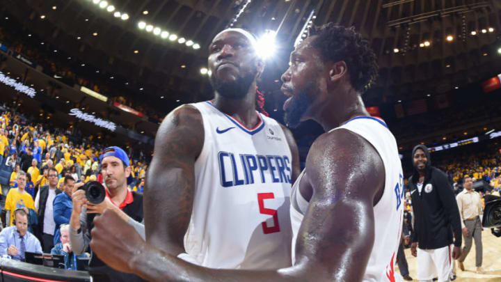 OAKLAND, CA - APRIL 24: Montrezl Harrell #5 celebrates with Patrick Beverley #21 of the LA Clippers after the game against the Golden State Warriors during Game Five of Round One of the 2019 NBA Playoffs on April 24, 2019 at ORACLE Arena in Oakland, California. NOTE TO USER: User expressly acknowledges and agrees that, by downloading and or using this photograph, user is consenting to the terms and conditions of Getty Images License Agreement. Mandatory Copyright Notice: Copyright 2019 NBAE (Photo by Andrew D. Bernstein/NBAE via Getty Images)