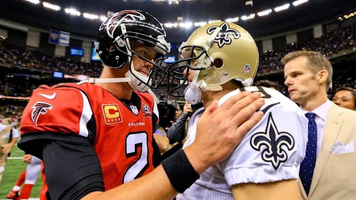 Oct 15, 2015; New Orleans, LA, USA; New Orleans Saints quarterback Drew Brees (9) and Atlanta Falcons quarterback Matt Ryan (2) talk following a game at the Mercedes-Benz Superdome. The Saints defeated the Falcons 31-21. Mandatory Credit: Derick E. Hingle-USA TODAY Sports