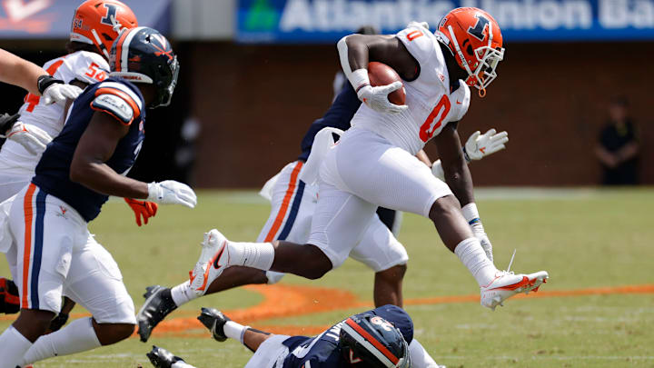 Sep 11, 2021; Charlottesville, Virginia, USA; Illinois Fighting Illini running back Joshua McCray (0) is tackled by Virginia Cavaliers free safety Joey Blount (29) in the third quarter at Scott Stadium. Mandatory Credit: Geoff Burke-USA TODAY Sports