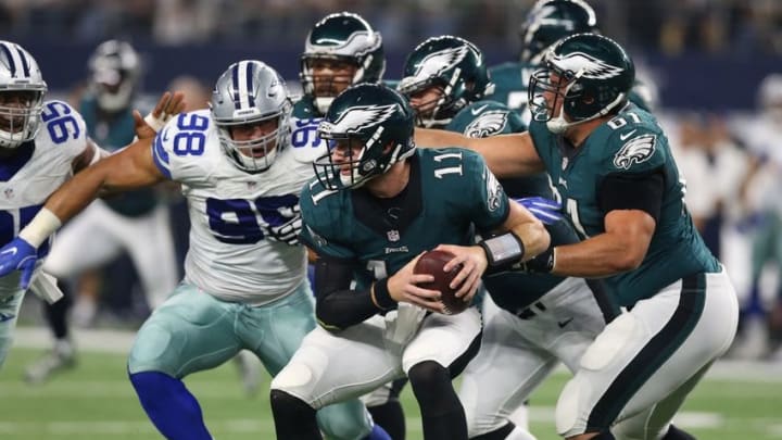 Oct 30, 2016; Arlington, TX, USA; Philadelphia Eagles quarterback Carson Wentz (11) is sacked by Dallas Cowboys defensive end Tyrone Crawford (98) in the second quarter at AT&T Stadium. Mandatory Credit: Matthew Emmons-USA TODAY Sports