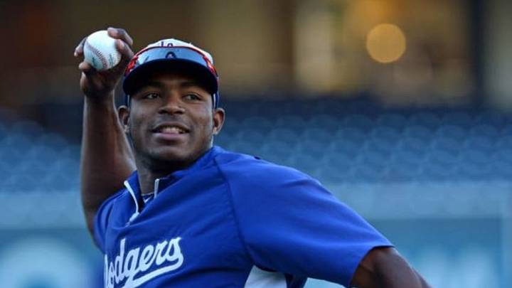 Aug 29, 2014; San Diego, CA, USA; Los Angeles Dodgers right fielder Yasiel Puig (66) smiles as he warms-up before the game against the San Diego Padres at Petco Park. Mandatory Credit: Jake Roth-USA TODAY Sports