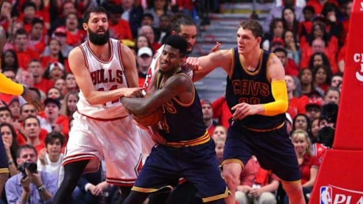 May 10, 2015; Chicago, IL, USA; Chicago Bulls forward Nikola Mirotic (44) and Cleveland Cavaliers guard Iman Shumpert (4) battle for the ball in the first half of game four of the second round of the NBA Playoffs at the United Center. Mandatory Credit: Dennis Wierzbicki-USA TODAY Sports