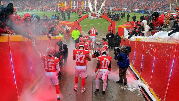 KANSAS CITY, MISSOURI - JANUARY 12: Patrick Mahomes #15, Travis Kelce #87, and Tyreek Hill #10 of the Kansas City Chiefs exit the tunnel onto the field during player introductions prior to the AFC Divisional round playoff game against the Indianapolis Colts at Arrowhead Stadium on January 12, 2019 in Kansas City, Missouri. (Photo by Jamie Squire/Getty Images)
