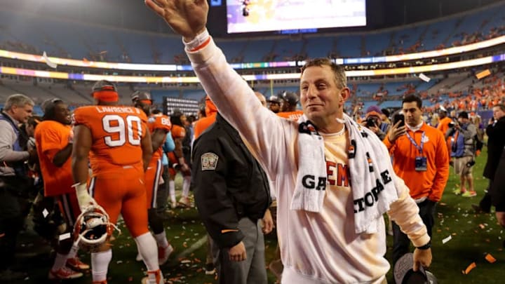 CHARLOTTE, NC - DECEMBER 02: Head coach Dabo Swinney of the Clemson Tigers celebrates after defeating the Miami Hurricanes 38-3 in the ACC Football Championship at Bank of America Stadium on December 2, 2017 in Charlotte, North Carolina. (Photo by Streeter Lecka/Getty Images)