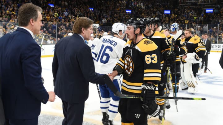 BOSTON, MA - APRIL 23: Brad Marchand #63 of the Boston Bruins shakes hands with Head Coach Mike Babcock of the Toronto Maple Leafs after Game Seven of the Eastern Conference First Round during the 2019 NHL Stanley Cup Playoffs at the TD Garden on April 23, 2019 in Boston, Massachusetts. (Photo by Steve Babineau/NHLI via Getty Images)