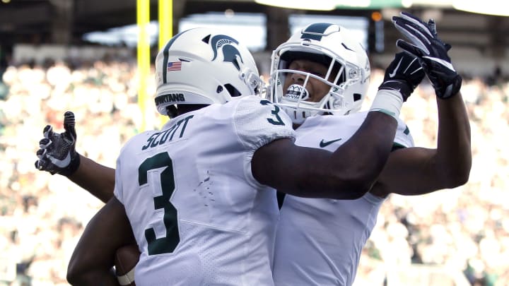 EAST LANSING, MI – SEPTEMBER 09: Running back LJ Scott #3 of the Michigan State Spartans celebrates his first quarter touchdown against the Western Michigan Broncos with wide receiver Cody White #7 of the Michigan State Spartans at Spartan Stadium on September 9, 2017 in East Lansing, Michigan. Michigan State defeated Western Michigan 24-14. (Photo by Duane Burleson/Getty Images)