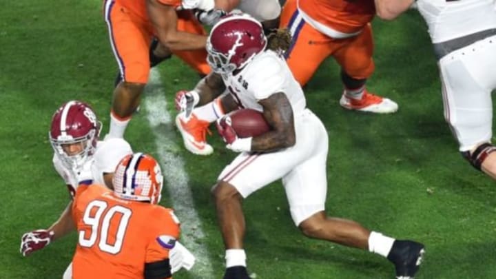 Jan 11, 2016; Glendale, AZ, USA; Alabama Crimson Tide running back Derrick Henry (2) runs the ball through Clemson Tigers defense during the first quarter in the 2016 CFP National Championship at University of Phoenix Stadium. Mandatory Credit: Gary A. Vasquez-USA TODAY Sports