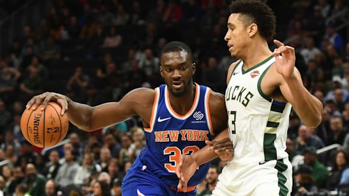 MILWAUKEE, WI - OCTOBER 22: Noah Vonleh #32 of the New York Knicks drives to the basket against Malcolm Brogdon #13 of the Milwaukee Bucks during a game at the Fiserv Forum on October 22, 2018 in Milwaukee, Wisconsin. NOTE TO USER: User expressly acknowledges and agrees that, by downloading and or using this photograph, User is consenting to the terms and conditions of the Getty Images License Agreement. (Photo by Stacy Revere/Getty Images)