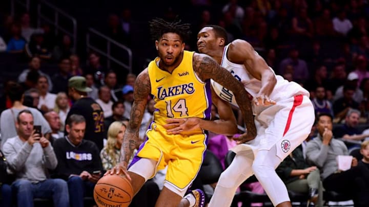 LOS ANGELES, CA - OCTOBER 13: Brandon Ingram #14 of the Los Angeles Lakers drives to the basket on Wesley Johnson #33 of the LA Clippers during the first half at Staples Center on October 10, 2017 in Los Angeles, California. (Photo by Harry How/Getty Images)