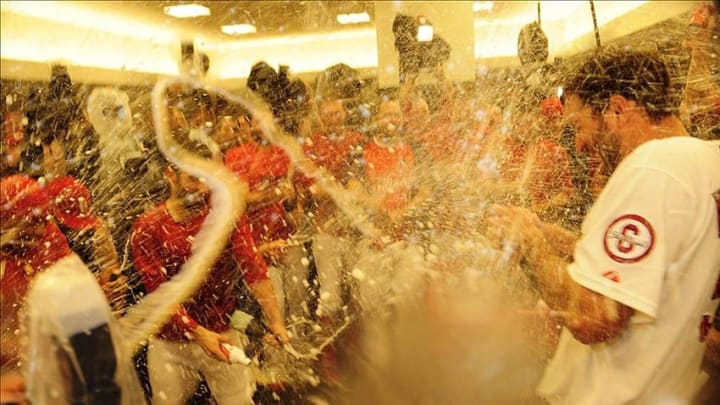 Oct 9, 2013; St. Louis, MO, USA; St. Louis Cardinals starting pitcher Adam Wainwright (50) celebrates with teammates after game five of the National League divisional series playoff baseball game against the Pittsburgh Pirates at Busch Stadium. The Cardinals won 6-1. Mandatory Credit: Jeff Curry-USA TODAY Sports