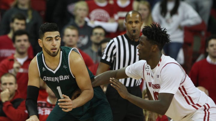 Dec 14, 2016; Madison, WI, USA; Green Bay Phoenix forward Kerem Kanter (1) attempts to keep the ball from Wisconsin Badgers forward Nigel Hayes (10) at the Kohl Center. Wisconsin defeated Green Bay 73-59. Mandatory Credit: Mary Langenfeld-USA TODAY Sports