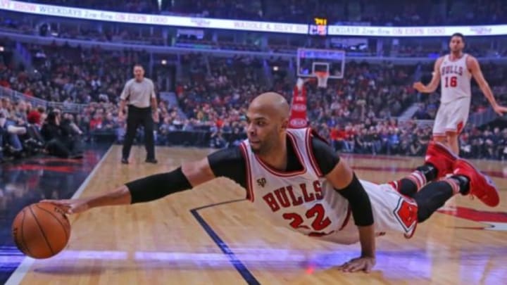 Dec 12, 2015; Chicago, IL, USA; Chicago Bulls forward Taj Gibson (22) dives for the ball during the first quarter against the New Orleans Pelicans at the United Center. Mandatory Credit: Dennis Wierzbicki-USA TODAY Sports