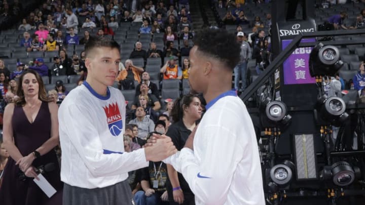 SACRAMENTO, CA - NOVEMBER 1: Bogdan Bogdanovic #8 and Yogi Ferrell #3 of the Sacramento Kings shake hands prior to the game against the Utah Jazz on November 1, 2019 at Golden 1 Center in Sacramento, California. NOTE TO USER: User expressly acknowledges and agrees that, by downloading and or using this photograph, User is consenting to the terms and conditions of the Getty Images Agreement. Mandatory Copyright Notice: Copyright 2019 NBAE (Photo by Rocky Widner/NBAE via Getty Images)