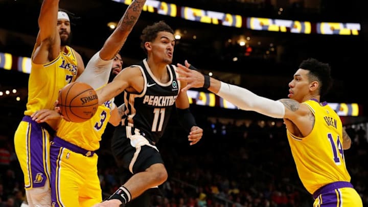 ATLANTA, GEORGIA - DECEMBER 15: Trae Young #11 of the Atlanta Hawks drives against JaVale McGee #7, Anthony Davis #3 and Danny Green #14 of the Los Angeles Lakers in the second half at State Farm Arena on December 15, 2019 in Atlanta, Georgia. NOTE TO USER: User expressly acknowledges and agrees that, by downloading and/or using this photograph, user is consenting to the terms and conditions of the Getty Images License Agreement. (Photo by Kevin C. Cox/Getty Images)