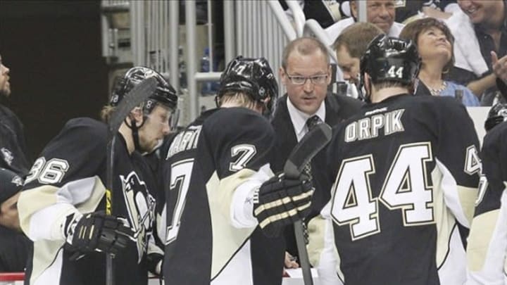Jun 1, 2013; Pittsburgh, PA, USA; Pittsburgh Penguins head coach Dan Bylsma (second from right) talks to left wing Jussi Jokinen (36) and defenseman Paul Martin (7) and defenseman Brooks Orpik (44) during a time-out against the Boston Bruins during the second period in game one of the Eastern Conference finals of the 2013 Stanley Cup Playoffs at the CONSOL Energy Center. Mandatory Credit: Charles LeClaire-USA TODAY Sports