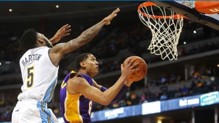 Dec 22, 2015; Denver, CO, USA; Los Angeles Lakers guard Jordan Clarkson (6) shoots the ball against Denver Nuggets forward Will Barton (5) during the second half at Pepsi Center. The Lakers won 111-107. Mandatory Credit: Chris Humphreys-USA TODAY Sports