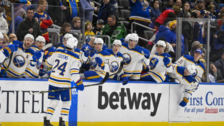 Jan 24, 2023; St. Louis, Missouri, USA; Buffalo Sabres center Dylan Cozens (24) is congratulated by teammates after scoring an empty net goal against the St. Louis Blues during the third period at Enterprise Center. Mandatory Credit: Jeff Curry-USA TODAY Sports