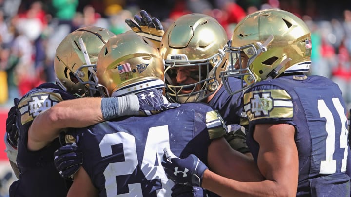 CHICAGO, ILLINOIS – SEPTEMBER 25: Jack Kiser #24 of the Notre Dame Fighting Irish is greeted by teammates after returning an interception for a touchdown against the Wisconsin Badgers at Soldier Field on September 25, 2021, in Chicago, Illinois. Notre Dame defeated Wisconsin 41-13. (Photo by Jonathan Daniel/Getty Images)