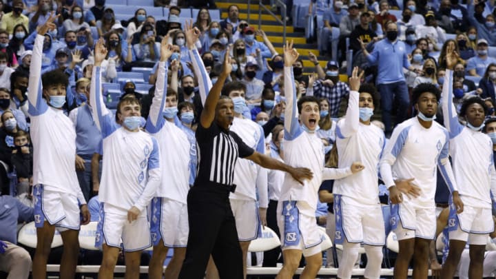CHAPEL HILL, NORTH CAROLINA - DECEMBER 21: The North Carolina Tar Heels react to a three-point shot during the second half of their game against the Appalachian State Mountaineers at the Dean E. Smith Center on December 21, 2021 in Chapel Hill, North Carolina. (Photo by Grant Halverson/Getty Images)