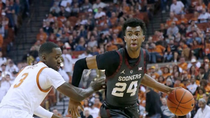 AUSTIN, TEXAS - JANUARY 19: Jamal Bieniemy #24 of the Oklahoma Sooners drives around Courtney Ramey #3 of the Texas Longhorns at The Frank Erwin Center on January 19, 2019 in Austin, Texas. (Photo by Chris Covatta/Getty Images)