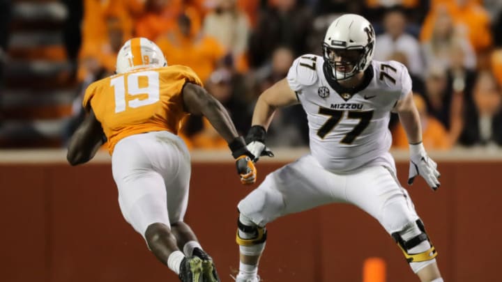 KNOXVILLE, TN - NOVEMBER 17: Paul Adams #77 of the Missouri Tigers blocks Darrell Taylor #19 of the Tennessee Volunteers during the second half of the game between the Missouri Tigers and the Tennessee Volunteers at Neyland Stadium on November 17, 2018 in Knoxville, Tennessee. Missouri won the game 50-17. (Photo by Donald Page/Getty Images)