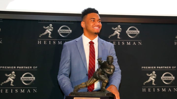NEW YORK, NY - DECEMBER 07: Alabama Quarterback Tua Tagovailoa poses with the Heisman Trophy at the New York Stock Exchange on December 7, 2018 at the New York Stock Exchange in New York, NY. (Photo by Rich Graessle/Icon Sportswire via Getty Images)