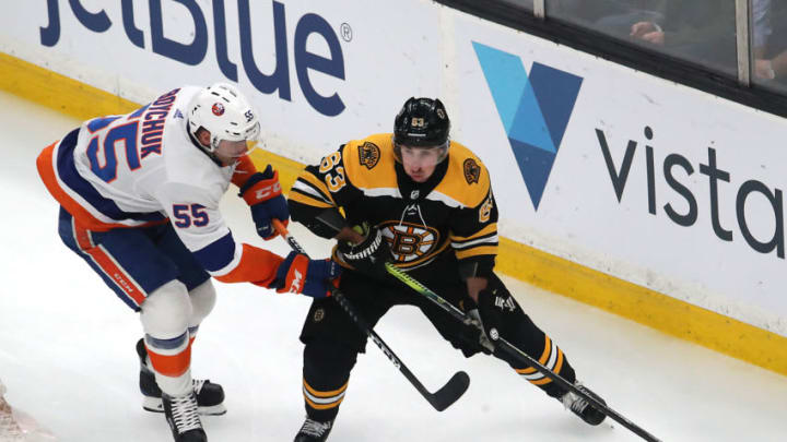 BOSTON - FEBRUARY 5: Boston Bruins' Brad Marchand (63) is defended by New York Islanders' Johnny Boychuk (55) during the first period. The Boston Bruins host the New York Islanders in a regular season NHL hockey game at TD Garden in Boston on Feb. 5, 2019. (Photo by Matthew J. Lee/The Boston Globe via Getty Images)