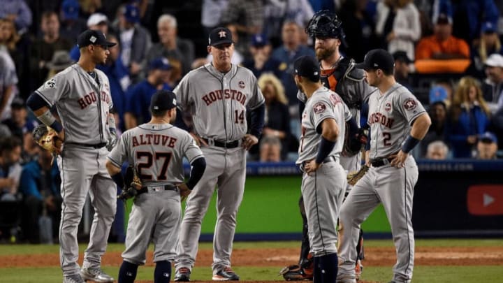 LOS ANGELES, CA - OCTOBER 31: Manager A.J. Hinch of the Houston Astros meets with players on the pitcher's mound during the eighth inning against the Los Angeles Dodgers in game six of the 2017 World Series at Dodger Stadium on October 31, 2017 in Los Angeles, California. (Photo by Kevork Djansezian/Getty Images)
