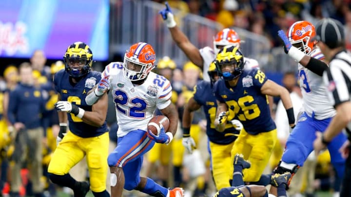ATLANTA, GEORGIA - DECEMBER 29: Lamical Perine #22 of the Florida Gators runs for a fourth quarter touchdown against the Michigan Wolverines during the Chick-fil-A Peach Bowl at Mercedes-Benz Stadium on December 29, 2018 in Atlanta, Georgia. (Photo by Mike Zarrilli/Getty Images)