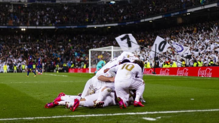 MADRID, SPAIN - MARCH 01: Mariano Diaz of Real Madrid (H) celebrating his goal with his teammates during the Liga match between Real Madrid CF and FC Barcelona at Estadio Santiago Bernabeu on March 1, 2020 in Madrid, Spain. (Photo by Eurasia Sport Images/Getty Images)