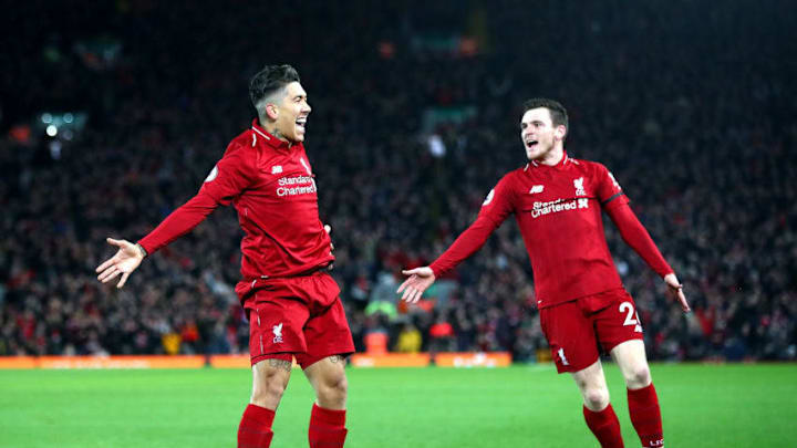 LIVERPOOL, ENGLAND - DECEMBER 29: Roberto Firmino of Liverpool celebrates with Andy Robertson after scoring his sides second goal during the Premier League match between Liverpool FC and Arsenal FC at Anfield on December 29, 2018 in Liverpool, United Kingdom. (Photo by Clive Brunskill/Getty Images)