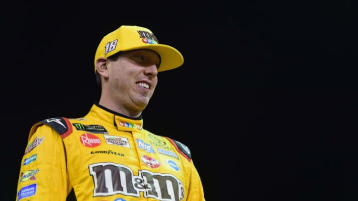 HOMESTEAD, FL - NOVEMBER 16: Kyle Busch, driver of the #18 M&M's Toyota, stands on the grid during qualifying for the Monster Energy NASCAR Cup Series Ford EcoBoost 400 at Homestead-Miami Speedway on November 16, 2018 in Homestead, Florida. (Photo by Jared C. Tilton/Getty Images)