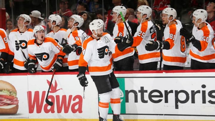 NEWARK, NJ - NOVEMBER 1: Sean Couturier #14 of the Philadelphia Flyers celebrates his game deciding goal in a shoot out during the game against the New Jersey Devils at the Prudential Center on November 1, 2019 in Newark, New Jersey. The Flyers defeated the Devils 4-3. (Photo by Andy Marlin/NHLI via Getty Images)