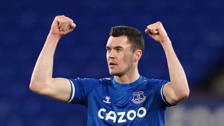 Everton's English defender Michael Keane reacts after the final whistle of the English Premier League football match between Everton and Arsenal at Goodison Park in Liverpool, north west England on December 19, 2020. (Photo by Jon Super / POOL / AFP) / RESTRICTED TO EDITORIAL USE. No use with unauthorized audio, video, data, fixture lists, club/league logos or 'live' services. Online in-match use limited to 120 images. An additional 40 images may be used in extra time. No video emulation. Social media in-match use limited to 120 images. An additional 40 images may be used in extra time. No use in betting publications, games or single club/league/player publications. / (Photo by JON SUPER/POOL/AFP via Getty Images)