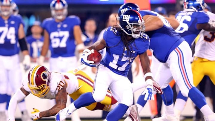 Sep 24, 2015; East Rutherford, NJ, USA; New York Giants wide receiver Dwayne Harris (17) runs with the ball past Washington Redskins defensive back Jeron Johnson (20) during the first quarter at MetLife Stadium. Mandatory Credit: Brad Penner-USA TODAY Sports