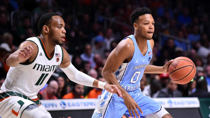 Jan 28, 2017; Coral Gables, FL, USA; North Carolina Tar Heels guard Nate Britt (0) dribbles the ball against Miami Hurricanes guard Bruce Brown (11) during the first half at Watsco Center. Mandatory Credit: Steve Mitchell-USA TODAY Sports