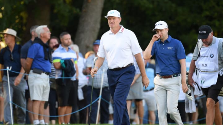 VIRGINIA WATER, ENGLAND - SEPTEMBER 19: Ernie Els of South Africa and Russell Knox of Scotland walk to the 18th hole during Day One of the BMW PGA Championship at Wentworth Golf Club on September 19, 2019 in Virginia Water, United Kingdom. (Photo by Ross Kinnaird/Getty Images)