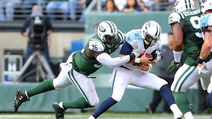 Dec 13, 2015; East Rutherford, NJ, USA; Tennessee Titans quarterback Marcus Mariota (8) is sacked by New York Jets defensive end Muhammad Wilkerson (96) during the second quarter at MetLife Stadium. Mandatory Credit: Brad Penner-USA TODAY Sports