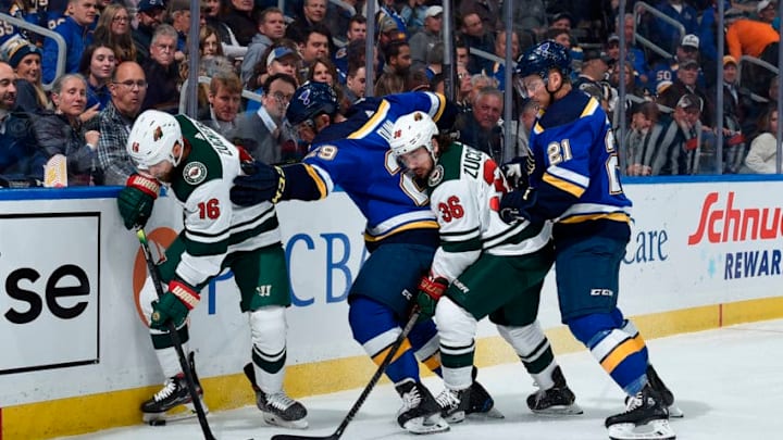 ST. LOUIS, MO - OCTOBER 30: Jason Zucker #16 and Mats Zuccarello #36 of the Minnesota Wild battle Vince Dunn #29 and Tyler Bozak #21 of the St. Louis Blues for the puck at Enterprise Center on October 30, 2019 in St. Louis, Missouri. (Photo by Joe Puetz/NHLI via Getty Images)