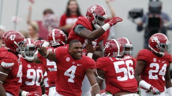 Oct 18, 2014; Tuscaloosa, AL, USA; Alabama Crimson Tide linebacker Reggie Ragland (19) is congratulated by teammates after he intercepted a pass from Texas A&M Aggies quarterback Kenny Hill (not shown) at Bryant-Denny Stadium. The Crimson Tide defeated the Aggies 59-0. Mandatory Credit: Marvin Gentry-USA TODAY Sports Oct 18, 2014; Tuscaloosa, AL, USA; Alabama Crimson Tide linebacker Reggie Ragland (19) is congratulated by teammates after he intercepted a pass from Texas A&M Aggies quarterback Kenny Hill (not shown) at Bryant-Denny Stadium. The Crimson Tide defeated the Aggies 59-0. Mandatory Credit: Marvin Gentry-USA TODAY Sports