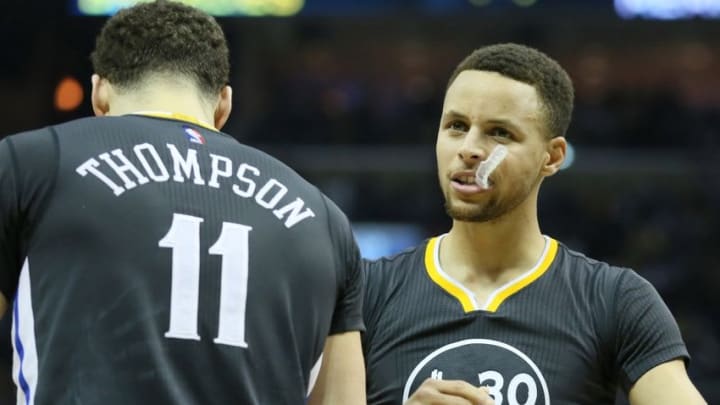 Apr 9, 2016; Memphis, TN, USA; Golden State Warriors guards Klay Thompson (11) and Stephen Curry (30) celebrate after defeating the Memphis Grizzlies 100-99 at FedExForum. Mandatory Credit: Nelson Chenault-USA TODAY Sports