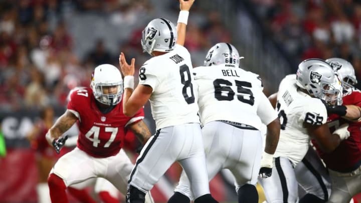 Aug 12, 2016; Glendale, AZ, USA; Oakland Raiders quarterback Connor Cook (8) against the Arizona Cardinals during a preseason game at University of Phoenix Stadium. Mandatory Credit: Mark J. Rebilas-USA TODAY Sports