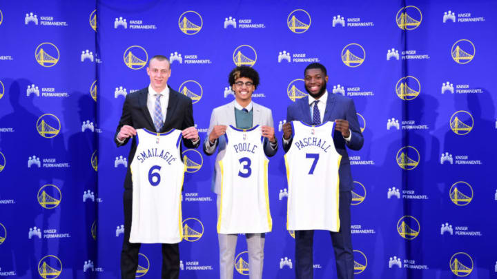 OAKLAND, CA - JUNE 24: Alen Smailagic #6, Jordan Poole #3, and Eric Paschall #7 of the Golden State Warriors pose for a photograph during a press conference on June 24, 2019 at Rakuten Performance Center in Oakland, California. NOTE TO USER: User expressly acknowledges and agrees that, by downloading and/or using this photograph, user is consenting to the terms and conditions of the Getty Images License Agreement. Mandatory Copyright Notice: Copyright 2019 NBAE (Photo by Noah Graham/NBAE via Getty Images)
