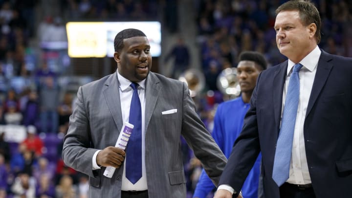 FORT WORTH, TX – JANUARY 06: Kansas Jayhawks assistant coach Jerrance Howard talks to head coach Bill Self as they leave the court for halftime during the Big 12 college basketball game between the TCU Horned Frogs and the Oklahoma Sooners on January 6, 2018, at the Ed & Rae Schollmaier Arena in Fort Worth, TX. Kansas won the game 88-84. (Photo by Matthew Visinsky/Icon Sportswire via Getty Images).