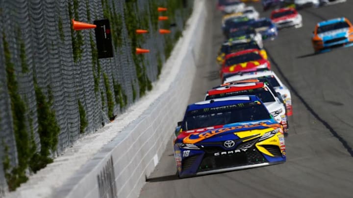 LONG POND, PA - JULY 30: Kyle Busch, driver of the #18 M&M's Caramel Toyota, leads a pack of cars during the Monster Energy NASCAR Cup Series Overton's 400 at Pocono Raceway on July 30, 2017 in Long Pond, Pennsylvania. (Photo by Jonathan Ferrey/Getty Images)
