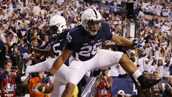 Dec 3, 2016; Indianapolis, IN, USA; Penn State Nittany Lions running back Saquon Barkley (26) celebrates with teammates after catching a touchdown pass against the Wisconsin Badgers in the second half during the Big Ten Championship college football game at Lucas Oil Stadium. Mandatory Credit: Brian Spurlock-USA TODAY Sports