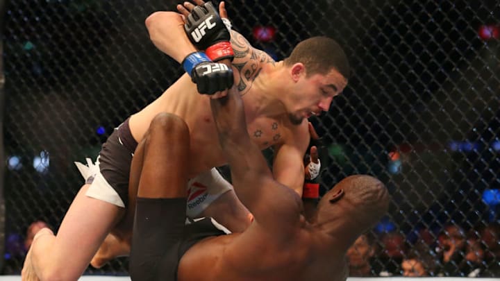 MELBOURNE, AUSTRALIA - NOVEMBER 15: Robert Whittaker of New Zealand pins down Uriah Hall of Jamaica in their middleweight bout during the UFC 193 event at Etihad Stadium on November 15, 2015 in Melbourne, Australia. (Photo by Quinn Rooney/Getty Images)